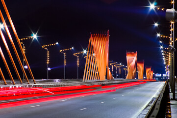 lights and glare of traffic cars at night on the highway