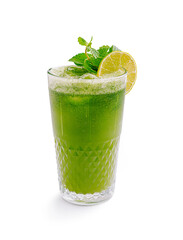 Refreshing green beverage served in a clear glass with mint leaves and lime on a white background