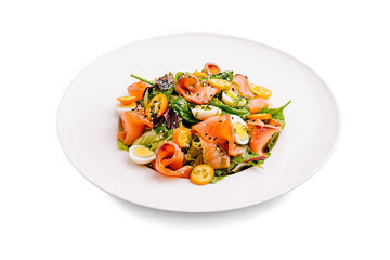 Fresh salad with smoked salmon, mixed greens, and cherry tomatoes prepared in a bright kitchen