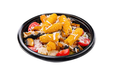 Delicious dish featuring crispy golden nuggets served with fresh vegetables and rice in a black bowl