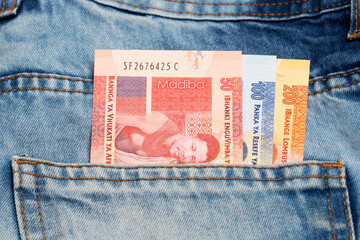 South African Rand in the pocket of blue jeans