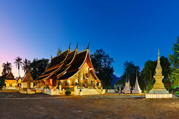 Historic Wat Xieng Thong known as Golden City Temple at the twilight in Luang Prabang, Laos.
