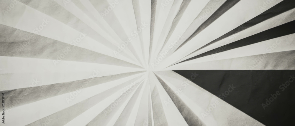 Poster striking geometric pattern created by angular paper folds on a dark background