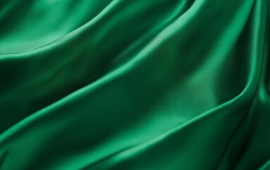 Fototapeta premium Abstract emerald green silk fabric texture.