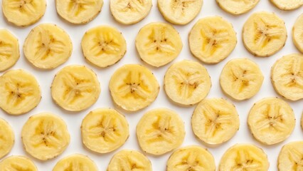 Top View of a Banana Slice Pattern Arranged Neatly on a White Background