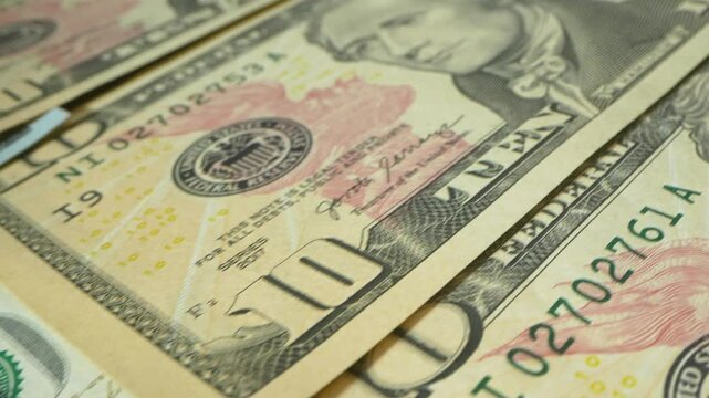Macro shot of US Dollars. Money Background.Portrait of Benjamin Franklin closeup on the bills for a hundred dollars. Dollars, money close up. 4k footage