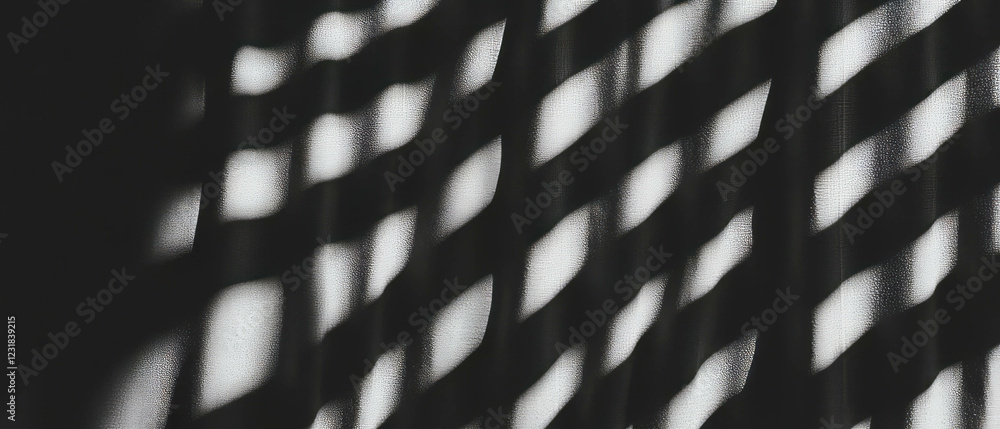 Poster curtain shadows create wavy patterns with soft light on a black background for a calming atmosphere