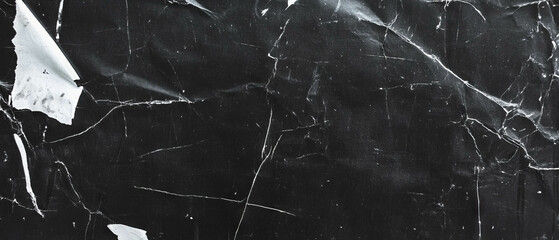 Overlay texture of distressed film with tears and wrinkles on a black background