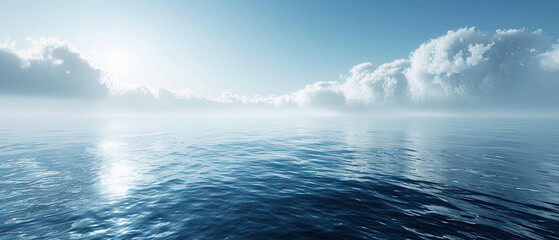 Obraz premium Calm seascape under a bright sky with soft clouds during the early morning hours