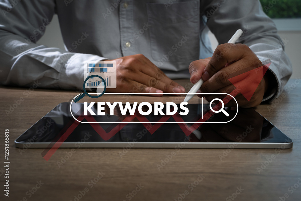 Poster keywords on laptop browse in office optimize seo engine man is using a tablet to type the word 