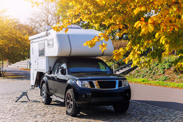 Scenic view pick-up off-road expedition truck parked many modern campervan recreational motor home...