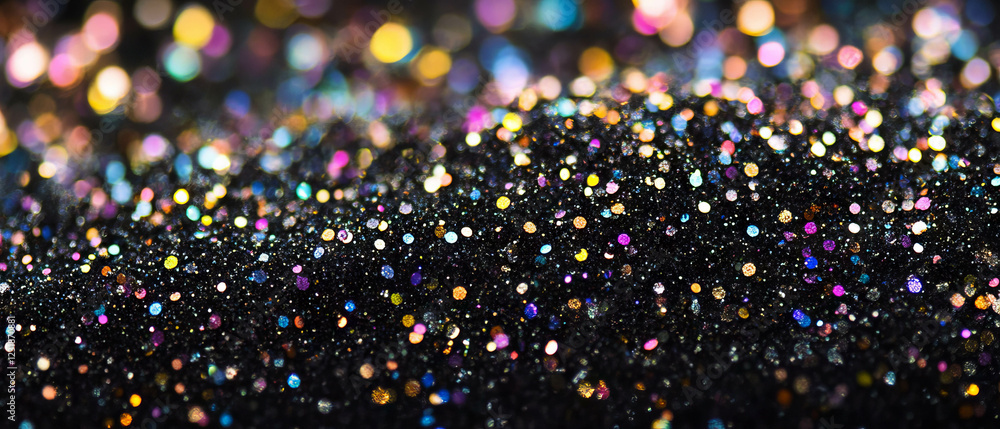 Poster glittering texture with clustered particles on a black background creating a vivid display