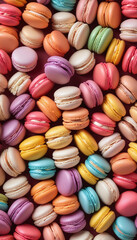 Close-up of tightly packed French macarons in a variety of pastel shades