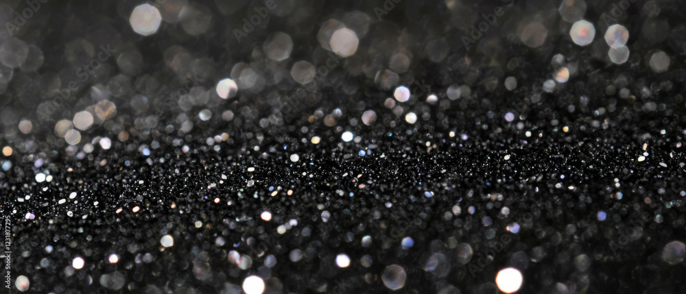 Poster shimmering glitter overlay texture on a dark background creating visual depth and contrast