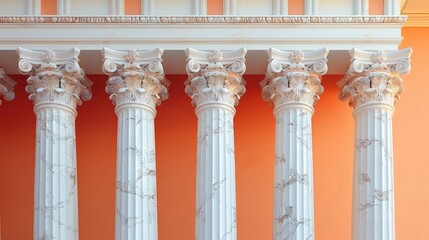 Naklejka premium Marble classical columns in front of an orange building facade, showcasing historic architectural style and vibrant contrast.