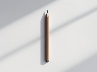 A sharp graphite pencil rests on a pristine white background, casting a soft shadow. Its unblemished form evokes creativity and potential, inviting the viewer to imagine the first stroke.