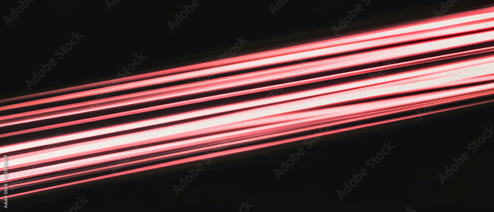 Poster dynamic light trails create vivid patterns against a black background in long exposure art