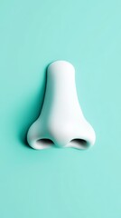 Fototapeta premium White nose sculpture set against a turquoise background, representing rhinoplasty and the pursuit of beauty while highlighting the significance of breathing and smell