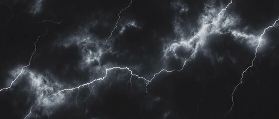 Thick bolts of lightning create a powerful display of energy and light set against a dark backdrop