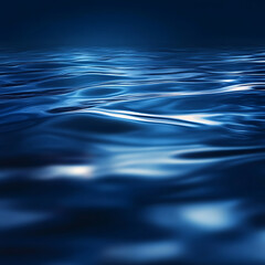 Dark blue abstract background. Reflection of light on a smooth surface of water with small waves.