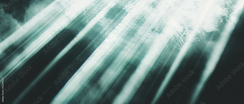Poster rays of light creating a dramatic focus against a dark background for visual impact