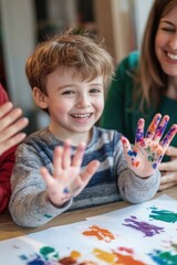 Fototapeta premium A mother and child with colorful handprints, promoting creativity and family bonding