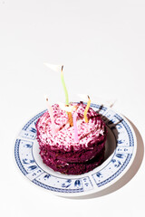 Purple cake with candles on white background, Birthday cake 