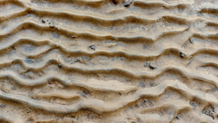 Sand art of a beautiful beach. Floating wave on the sand