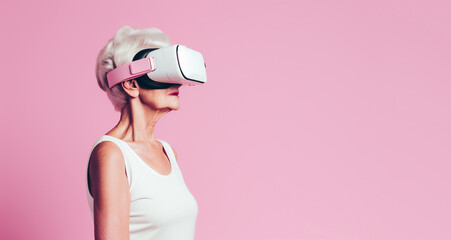 Senior woman enjoying wellness through a virtual reality headset. She is immersed in a virtual world, with a sense of relaxation and engagement