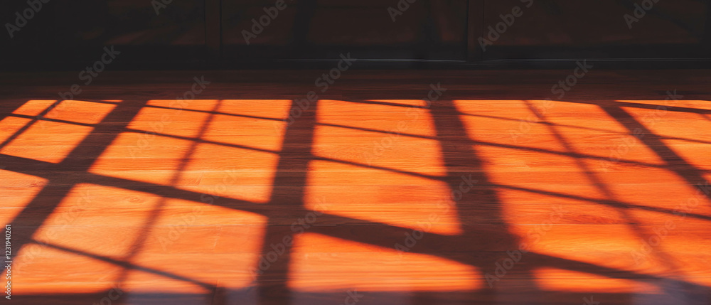 Poster window reflections casting textured patterns on wooden surface with dark background