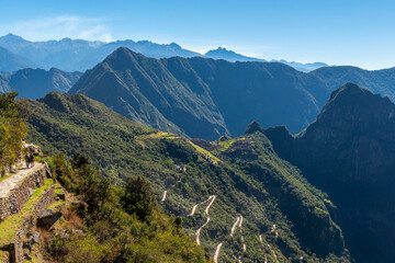 People walking the Inca Trail from the Sun Gate to Machu Picchu, Cusco, Peru.