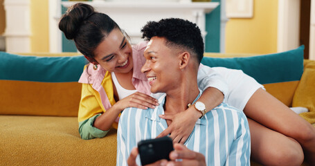 Happy, phone and couple on sofa in home reading celebrity gossip blog on social media together. Smile, love and young man and woman relax in living room with cellphone for online networking at house.