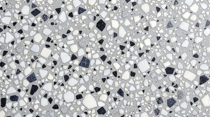Detailed close-up of a terrazzo surface.  The pattern features chips of varying sizes and colors set in a light gray matrix.  Ideal for backgrounds, textures, design projects, or architectural materia