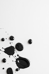 Black ink blots are splashed artistically across a white canvas, showcasing soft edges and negative space, ideal for bold art campaigns or design inspirations