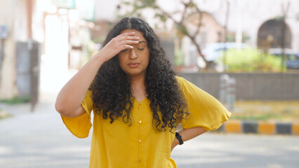 Stressed Indian Woman with Curly Hair