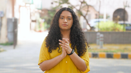 Disappointed Indian Woman with Curly Hair Clapping