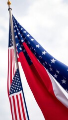 Obraz premium Dual Identity Majestic Flags of Texas and the United States Stand Tall Against a Clear Blue Sky, Symbolizing Unity and Pride.