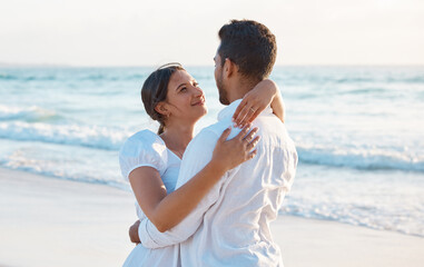 Couple, hug and care at beach on vacation with love, happy and together for memory in summer. People, woman and man with embrace, connection and marriage with loyalty, smile and ocean in Indonesia