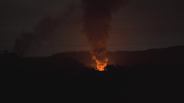 Extreme fire breakout with black smoke due to stubble burning of crops leftover during night time in north india