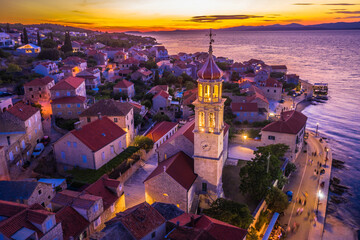 Sutivan on the island of Brač at dusk in summer, featuring the Church of the Assumption of the...