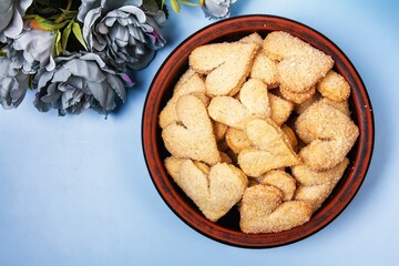 Cookies hearts and flowers on a blue background