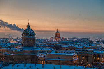 View from above of Kazan Cathedral and St Isaac's Cathedral from the Duma Tower. Frosty winter evening.