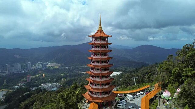 Aerial 4K footage of a Chin Swee Caves Temple at Genting Highlands, Malaysia. A famous temple on top of a hill.