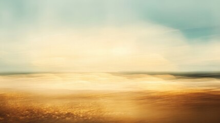 A blurry photo of a beach with a bright blue sky