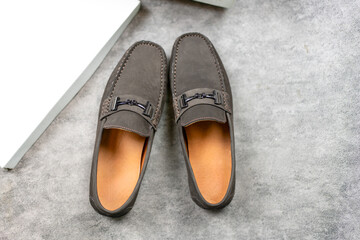 Pair of brown leather loafer shoes.