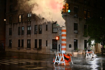 Steam vents from a stack on a New York street