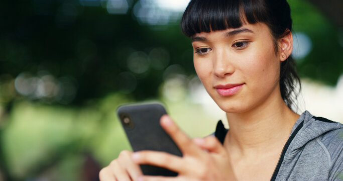 Outdoor, woman and fitness with smartphone for scroll, online exercise and download app for training. Bokeh, female person and browse with mobile for digital video, watch workout tutorial or wellness