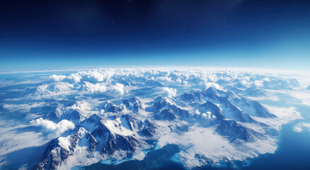Naklejka premium This breathtaking perspective reveals a vast landscape of towering mountains covered in snow, surrounded by scattered clouds