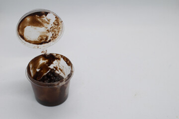 Chocolate in plastic cup container.White background