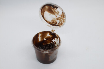 Chocolate in plastic cup container.White background